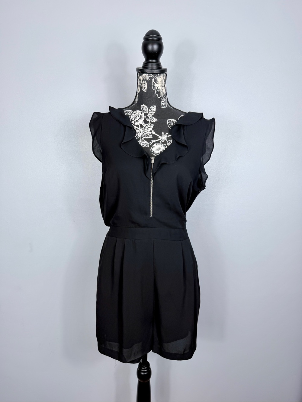 Express black sleeveless ruffled hem quarter zip chiffon lined romper size 12